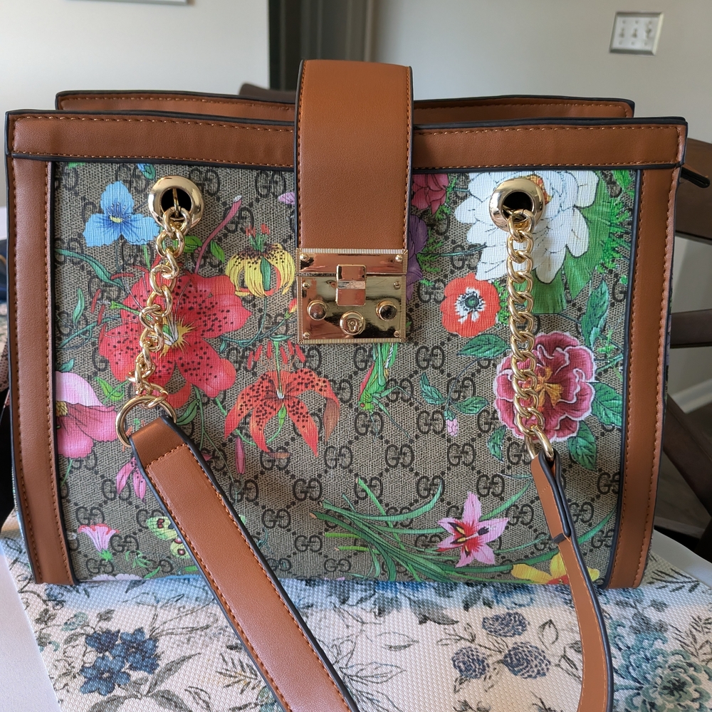 Floral Design Shoulder Handbag With Gold Accents.